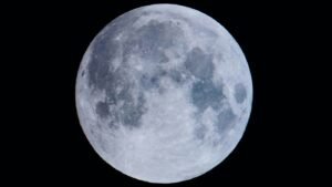 Full Hunter's Moon over dark October landscape